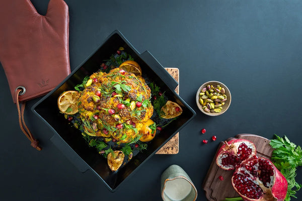 Roasted cauliflower with tahini dressing, pomegranate and pistachio nuts